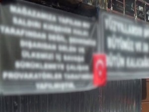 İş yeri yakılan Kürt vatandaştan anlamlı pankart
